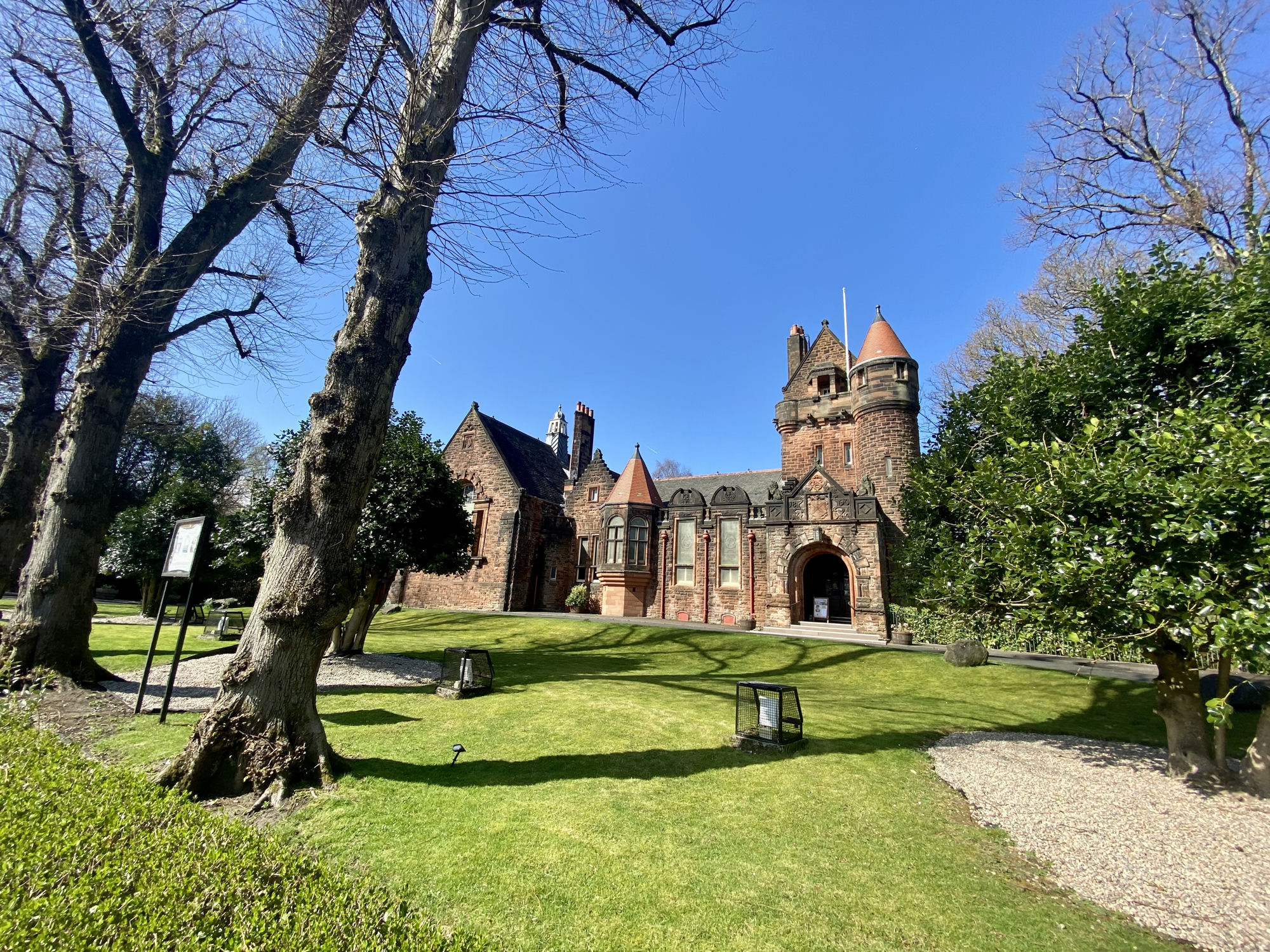 Pollokshields Burgh Hall with gardens and blue sky